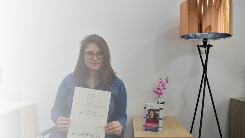 A student recieving the certificate of completion from The Language Fair in London