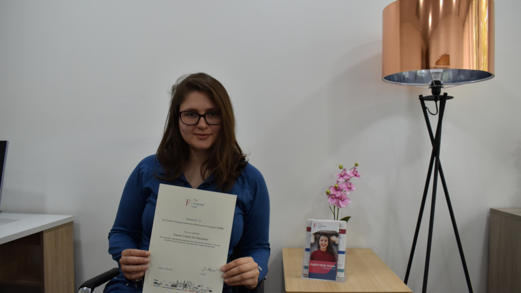 A student recieving certificate of completion with The Language Fair London